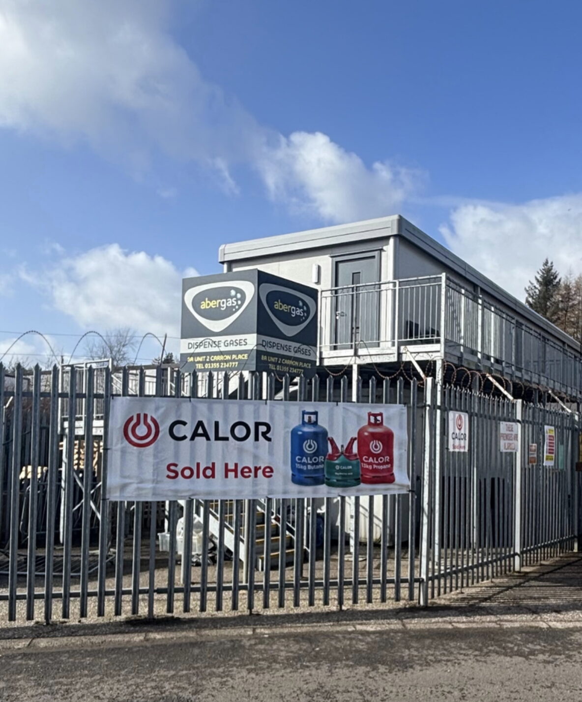 AberGas depot and Calor gas stockist sign behind security fencing